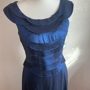 Floor length “petite size” iridescent navy blue sleeveless dress.